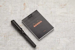 Rhodia No. 11 A7 Notepad - Black, Lined -Office Supply Series Store Rhodia ClassicNotepad TopBound A4 No11 Stapled Lined Black 1